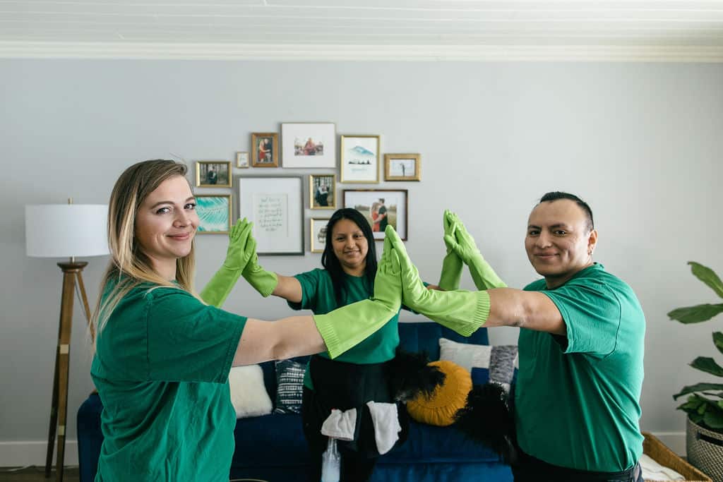 Three Technicians High-Five Each Other